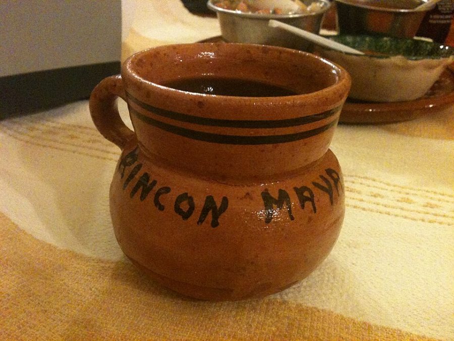 Café de olla in a clay jarrito